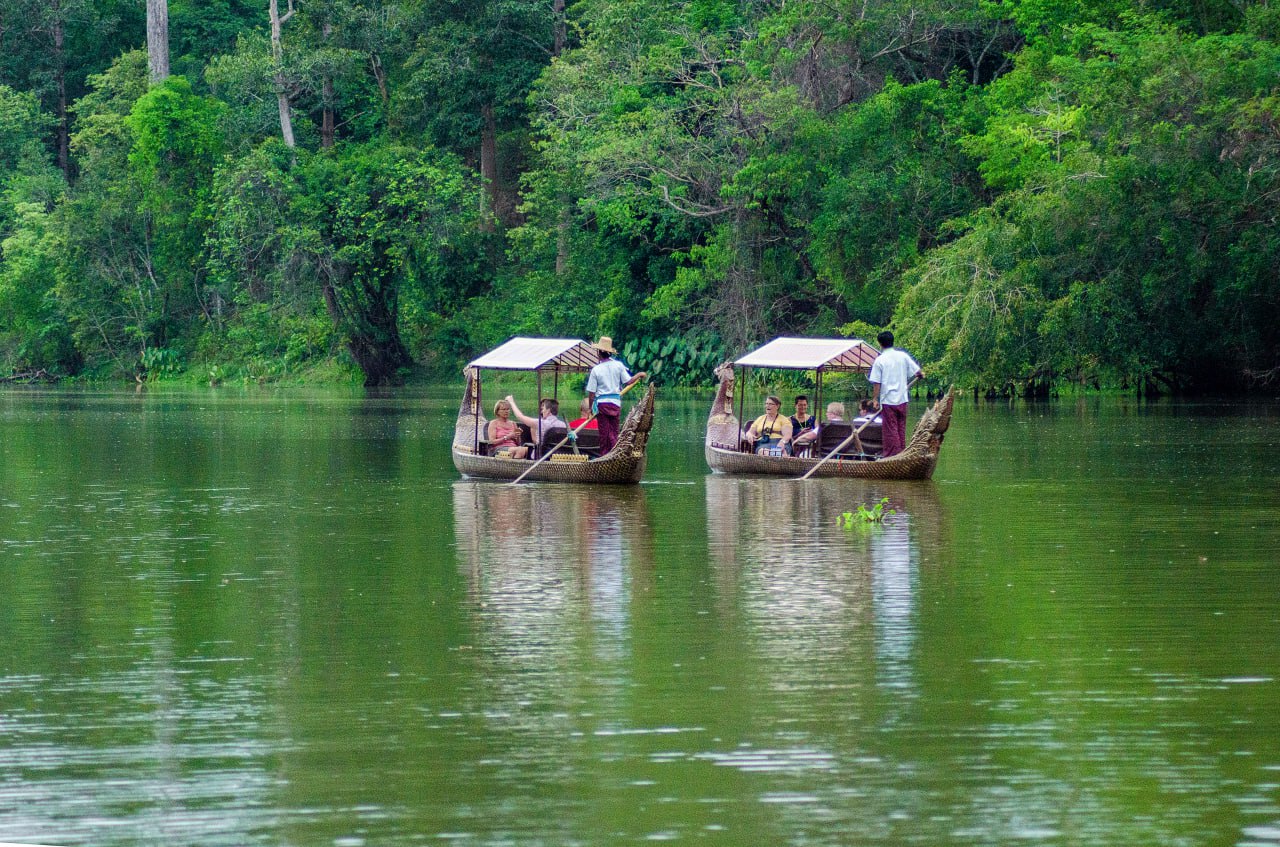 Experience a Private Traditional Boat Canape Package near Tonle Om Gate, Siem Reap